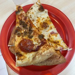 two slices of pizza on a red plate