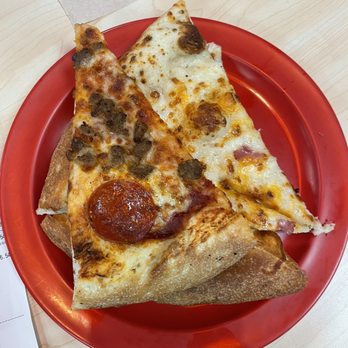 Cicis Pizza - two slices of pizza on a red plate - Pizza Near Me - HIALEAH, Florida