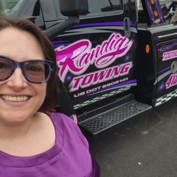 Randig Towing - ID: a Lori Beth in purple satin pajamas in front of a Randig truck