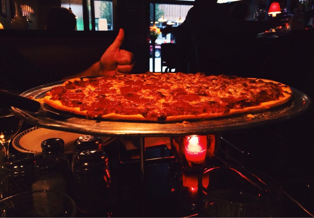Photo of Gino's North Pizzeria - Chicago, IL, United States. cracker crust, real pepperoni