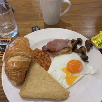 Gairloch Hotel - Breakfast!  Poached egg, potato cake, bacon, mushrooms, beans, coffee, and a croissant. Very tasty. - Hotels Near Me