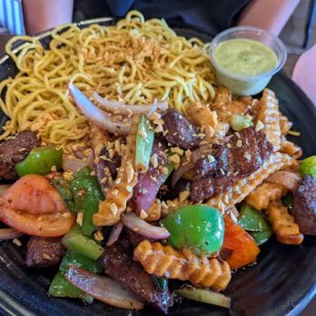 OMELI Kitchen - Loma Saltada sun rice for garlic noodles - Vietnamese Near Me - Fullerton, California