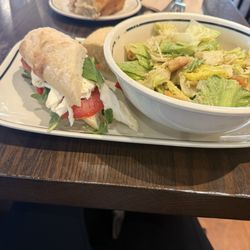 Corner Bakery Cafe - Tomato Mozzarella, Caesar salad, bread roll, Cinnamon Roll in the back