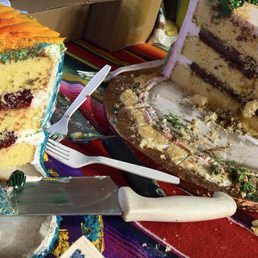 2 half served birthday cakes
