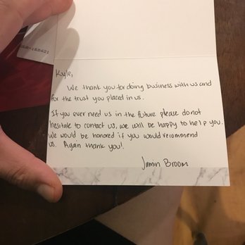 Integrity Roofing Systems - Christmas card 2022 - A handwritten note on a white card expresses gratitude to Kyle for business and trust, offering future assistance and a recommendation. - Roofing Near Me - Pleasanton, California