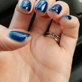 Red Persimmon - Up close of the sloppy nails. They are thick, not fully painted  on the edges and scuffed. - Nail Salons Near Me - Riverside, California