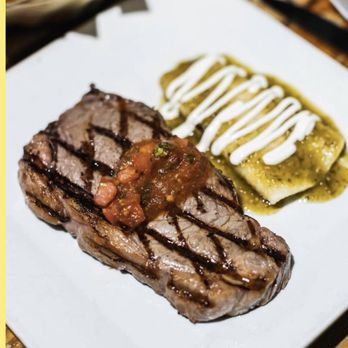 Patron Mexican Grill - a steak and pickle on a plate - Mexican Near Me - New York, New York Patron Mexican Grill - a steak and pickle on a plate - Mexican Near Me - New York, New York