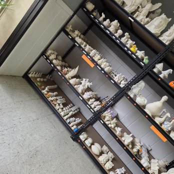 Kolorful Kiln - Accidentally taken on my way out. Shelves on either side of entrance with pieces you can choose to paint with glaze. - Paint-Your-Own Pottery Near Me - Peru, Indiana