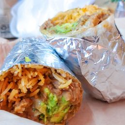 two burritos wrapped in foil