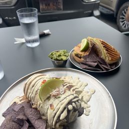 Brisket Burrito, we got it Rainbow (all the sauces). And a cubano with a side of guac. Brisket Burrito, we got it Rainbow (all the sauces). And a cubano with a side of guac.