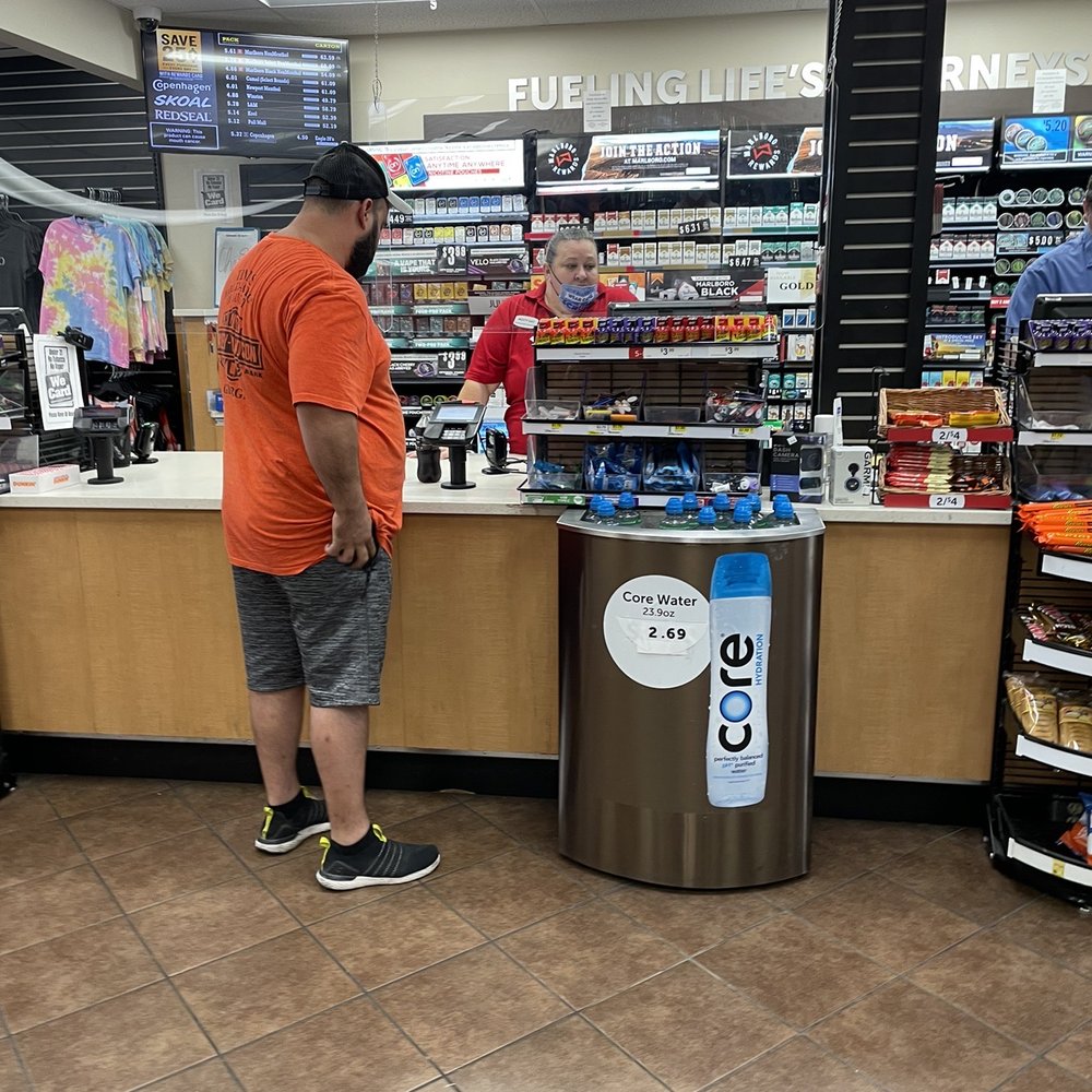 QuikTrip - a man standing in a grocery store - Gas Stations Near Me - Sandy Springs, Georgia QuikTrip - a man standing in a grocery store - Gas Stations Near Me - Sandy Springs, Georgia
