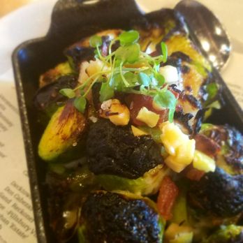 Beckett's Table - App- brussel sprouts. Had onions and I think chunks of garlic that you see on the top. Just add a little more sauce and they'd be perfect! - New American Near Me - Phoenix, Arizona