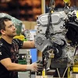 GM Fairfax Plant Tour - Engine set of a Chevy Malibu  Luis Aceves GM Worker at Fairfax assembly line.