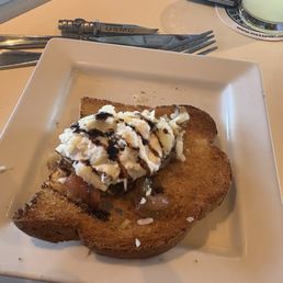 What I got . One little tomato some mozzarella that barely covered the hard toast ! All 4 pieces