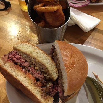 Burger District  - Delicious burger ordered medium rare and curly fries. So good!! - Burgers Near Me - Arlington, Virginia