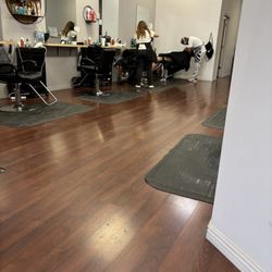 Haircut Spot - Part of the salon and employees working on clients