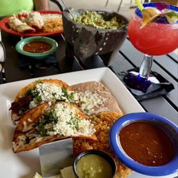 My  Quesabirria Taco plate with hubbie's combo and beer in the background