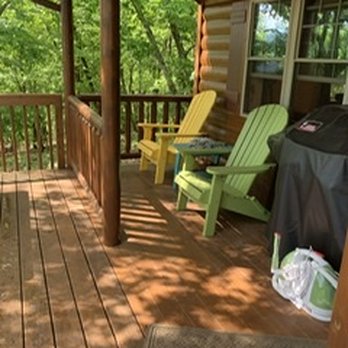 Cozy Cabins - a porch with chairs and a grill - General Contractors Near Me - New Holland, Pennsylvania Cozy Cabins - a porch with chairs and a grill - General Contractors Near Me - New Holland, Pennsylvania