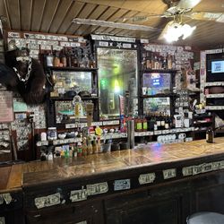 The Callahan Emporium - The old wooden bar.
