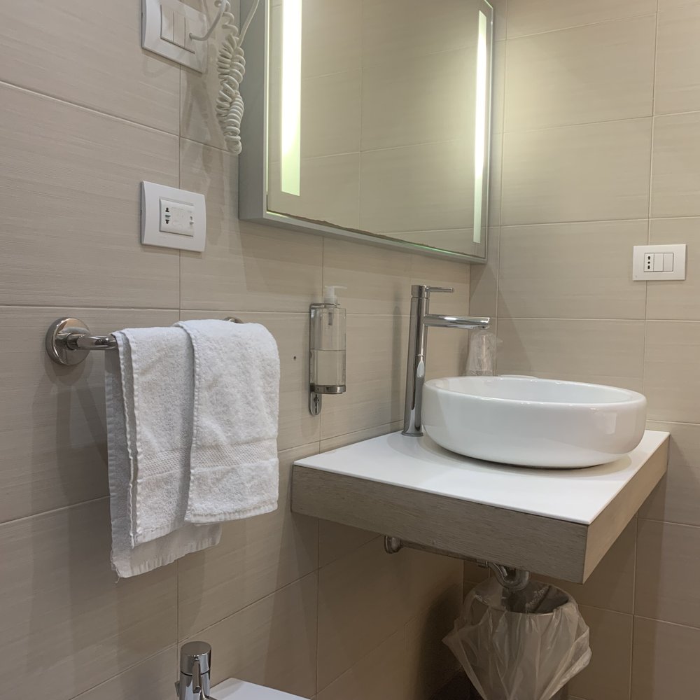 Alma di Alghero Hotel - Room 302 bathroom with small sink & surface area. - Resorts Near Me - Alghero, SS
