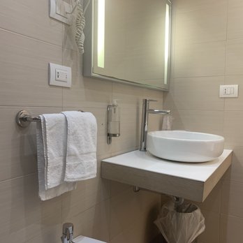 Alma di Alghero Hotel - Room 302 bathroom with small sink & surface area. - Resorts Near Me - Alghero, SS