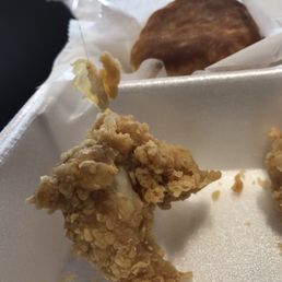 fried chicken and a biscuit fried chicken and a biscuit