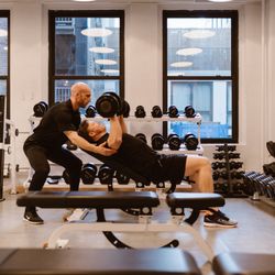 Zach Moore Personal Training - Whenever my clients perform a heavy set, I am always there spotting them. Here Kyle is pushing through his final heavy set of presses.