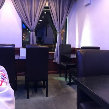 Onsen - a table and chairs in a restaurant - Japanese Near Me - Oakdale, New York Onsen - a table and chairs in a restaurant - Japanese Near Me - Oakdale, New York