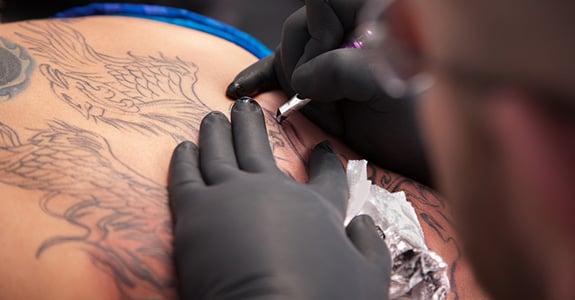 Outrageous Tattoos Logo