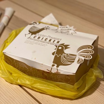 Yetnal Tongdak - a chicken sandwich wrapped in plastic - Korean Near Me - Flushing, New York