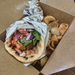Falafel wrap and potato wedges