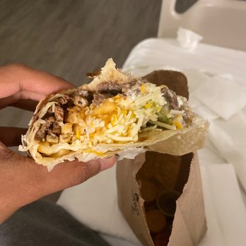 Vallarta Express - a hand holding a burrito - Mexican Near Me - La Mesa, California Vallarta Express - a hand holding a burrito - Mexican Near Me - La Mesa, California