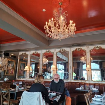 Cafe Bouffon - a man and a woman sitting at a table - French Near Me - Stratford, Ontario Cafe Bouffon - a man and a woman sitting at a table - French Near Me - Stratford, Ontario