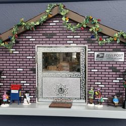 Fairy Doors of Ann Arbor - The fairy post office in Whitmore Lake, MI. The little people just showed up for caroling. It's always changing.