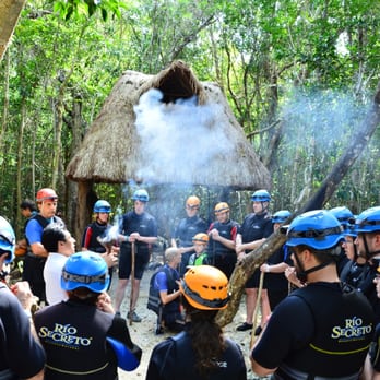 Rio Secreto - Receiving a Mayan Blessing before entering the river. - Tours Near Me - Chacalal, ROO Rio Secreto - Receiving a Mayan Blessing before entering the river. - Tours Near Me - Chacalal, ROO
