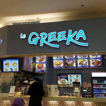 Le Greeka - a woman standing in front of the counter - Food Court Near Me - Toronto, Ontario Le Greeka - a woman standing in front of the counter - Food Court Near Me - Toronto, Ontario