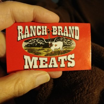 Ranch Brand Meats - a hand holding a ranch brand meats sticker - Meat Shops Near Me - Flint, Texas