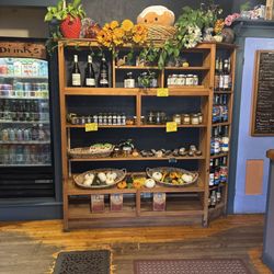 Sandy's Books and Bakery - Bookshelves of some goodies they sell