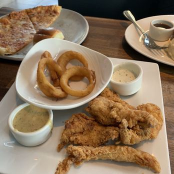 Yard House - Appetizers: chicken strips, onion rings and pizza. Both were really good. - New American Near Me - Lombard, Illinois