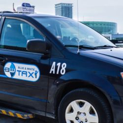 Blue & White Taxi - Blue and white taxi comes equipped with ramps helping people who use wheelchairs to get around.