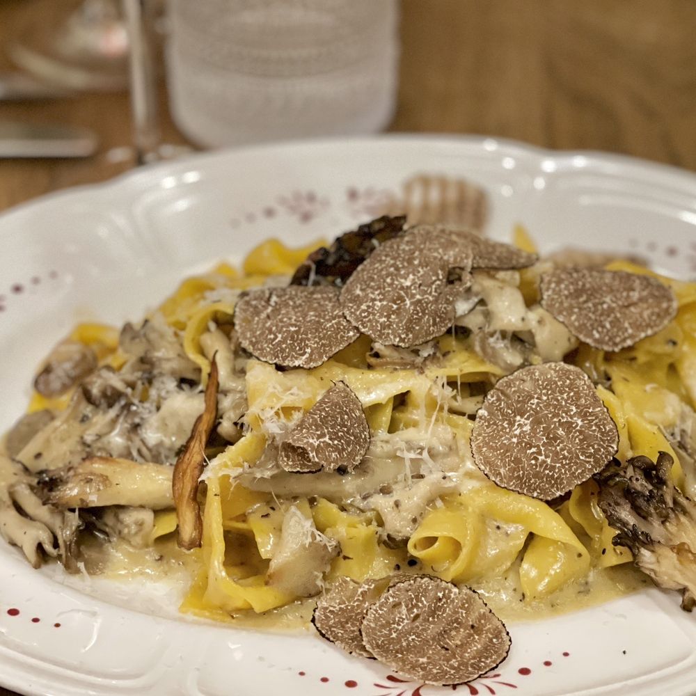 Sfoglina - Downtown - a plate of pasta with mushrooms and cheese - Italian Near Me - Washington, DC, District of Columbia Sfoglina - Downtown - a plate of pasta with mushrooms and cheese - Italian Near Me - Washington, DC, District of Columbia