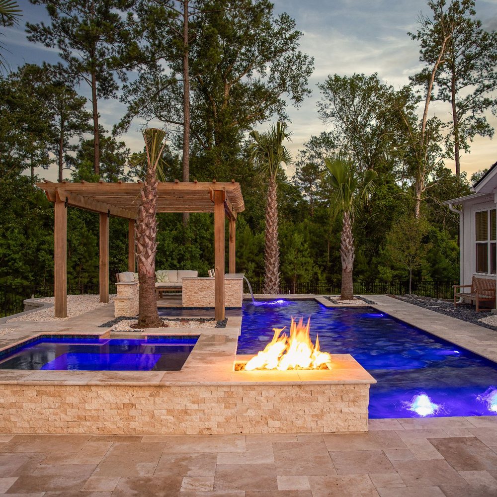 Fister Landscapes - a pool with a fire pit - Landscaping Near Me Fister Landscapes - a pool with a fire pit - Landscaping Near Me