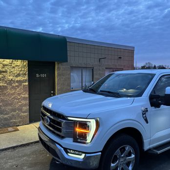 Koerber Construction & Contracting - a white truck parked in front of a building - Roofing Near Me - Rochester Hills, Michigan Koerber Construction & Contracting - a white truck parked in front of a building - Roofing Near Me - Rochester Hills, Michigan
