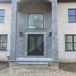 Benn's Masonry LLC - Fieldstone front entrance and arch design