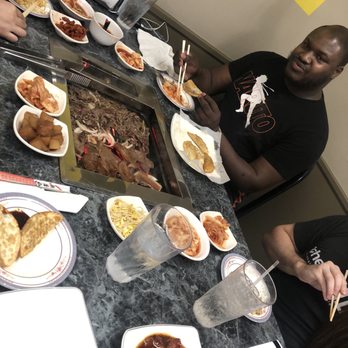 Kum's Cafe - Bolgogi, beef ribs(bottom of grill), pot stickers, kbbq pork(bottom plate before put on the grill). - Korean Near Me - Louisville, Kentucky