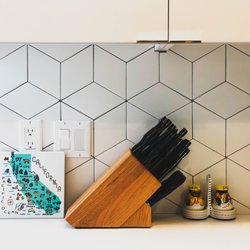Better Together Builders - Backslash with black tile grout
