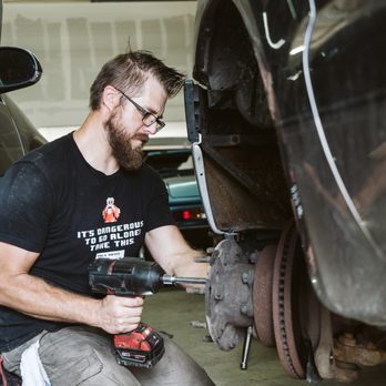 Fort Collins Complete Auto Repair - Mechanic working on wheels of car. - Auto Repair Near Me - Fort Collins, Colorado Fort Collins Complete Auto Repair - Mechanic working on wheels of car. - Auto Repair Near Me - Fort Collins, Colorado
