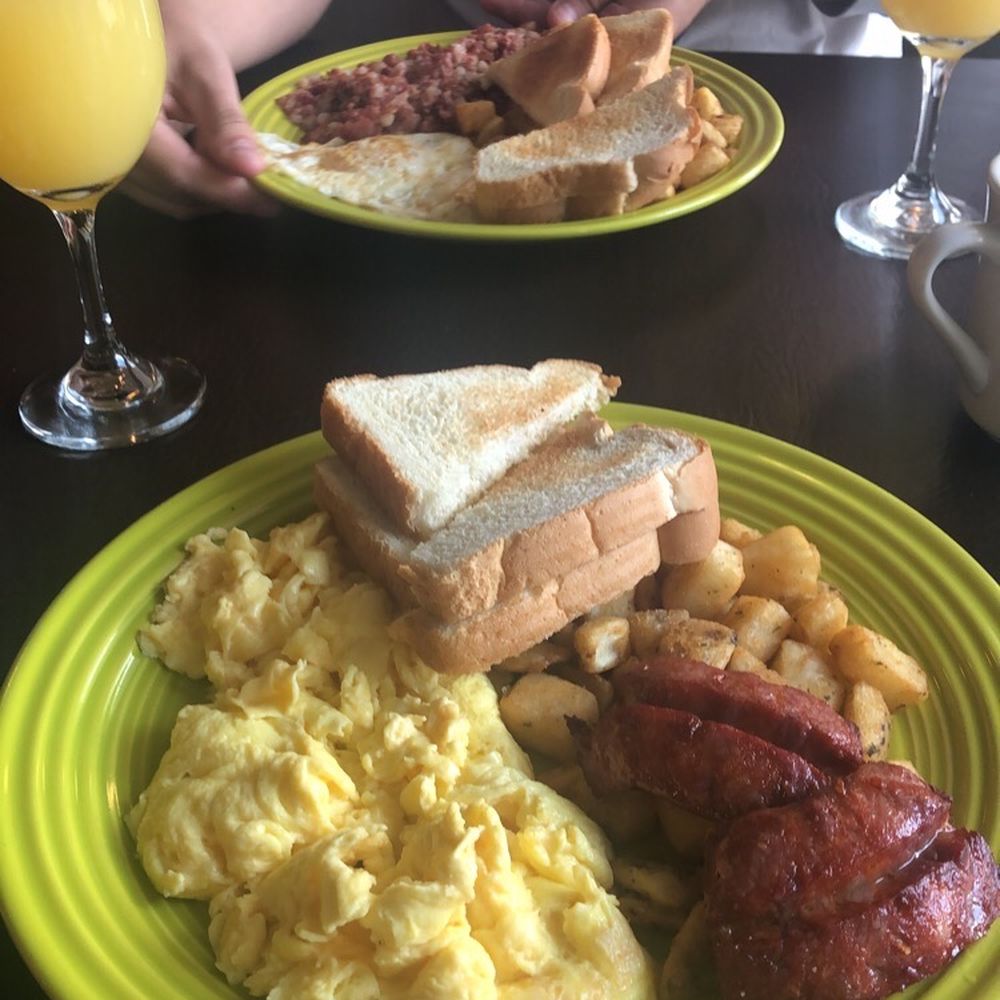 Modern Bistro - Front plate is chourico with scrambled eggs, home fries and toast back plate is the same with corned beef hash - Breakfast & Brunch Near Me - Cumberland, Rhode Island Modern Bistro - Front plate is chourico with scrambled eggs, home fries and toast back plate is the same with corned beef hash - Breakfast & Brunch Near Me - Cumberland, Rhode Island