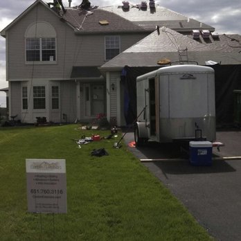 Corbin Exteriors - the roof of a house being repaired - Roofing Near Me - South Saint Paul, Minnesota Corbin Exteriors - the roof of a house being repaired - Roofing Near Me - South Saint Paul, Minnesota