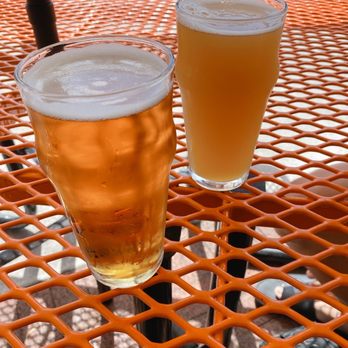 Suncreek Brewery - two glasses of beer on a table - Brewpubs Near Me - Clermont, Florida Suncreek Brewery - two glasses of beer on a table - Brewpubs Near Me - Clermont, Florida
